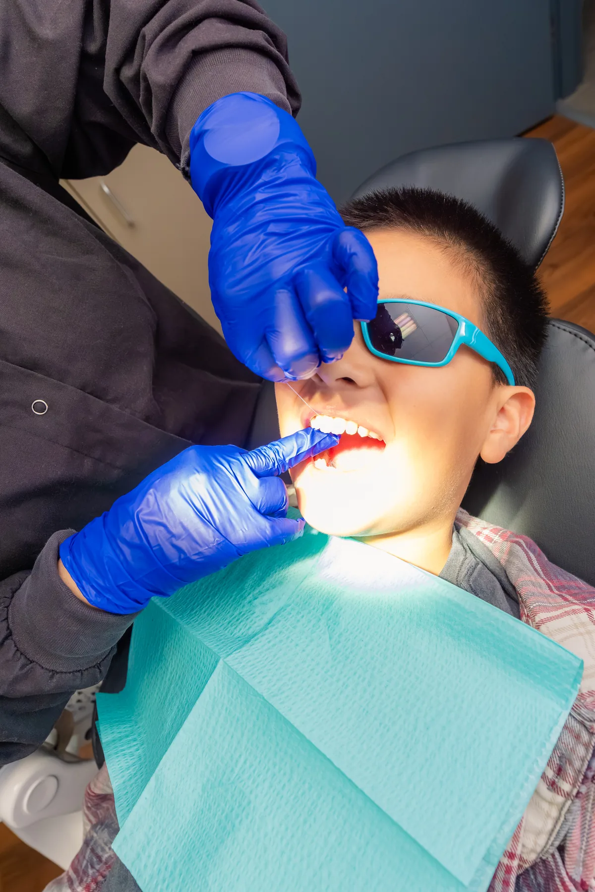 Close-up of a gentle dental treatment on a young patient at Pleasant Valley Pediatric Dentistry